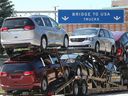 Trucks with Chrysler Pacific models drove into the Windsor Ambassador Bridge. The Trump administration threatens to make those vehicles for U.S. consumers more expensive by increasing import tariffs on all Canadian goods.