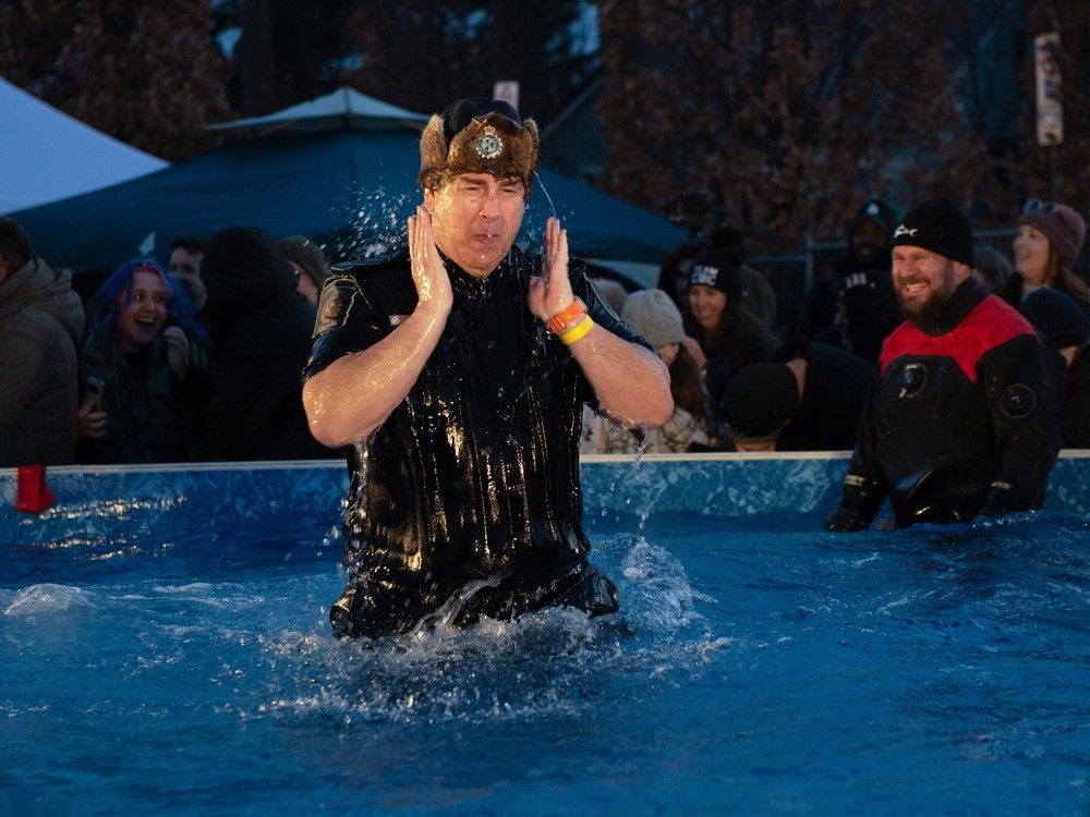  nothing like a refreshing dip in the pool — a representative from the canada border services agency clears cold water from his eyes at the polar plunge for special olympics ontario in downtown windsor on friday, feb. 28, 2025.