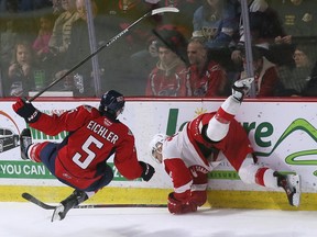 Windsor Spitfires defender Joseph Eichler left to collide with Sault Ste. Marie Greyhounds forward Travis Hayes was in a game at the WFCU Center on Thursday.