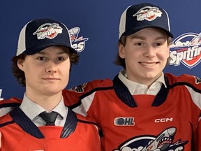 Rookie third-round draft pick Andrew Robinson, left and second-round draft pick Carter Hicks helped Windsor Spitfires get injured on defense.