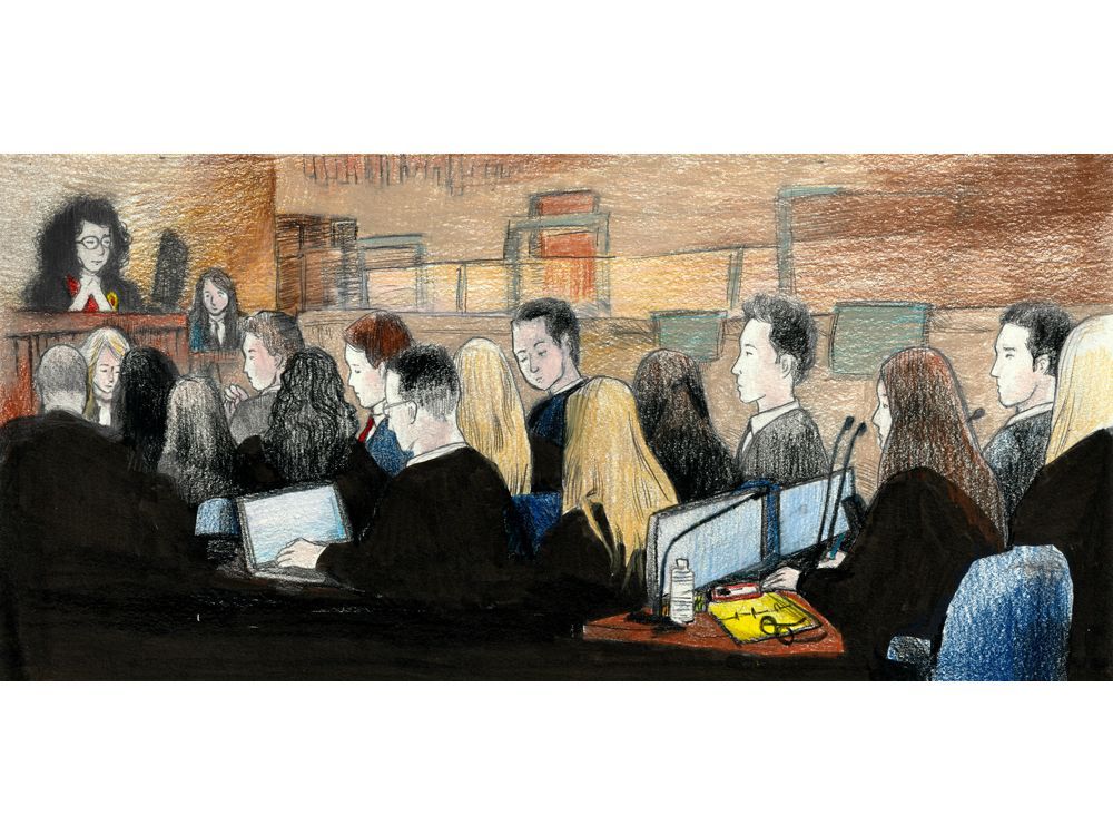 Superior Court Justice Maria Carroccia, upper left, looks at defendants Michael McLeod, Carter Hart, Alex Formenton, Dillon Dube and Cal Foote on the opening day of the trial of five members of the 2018 Canadian world junior hockey team in a London courtroom on Tuesday, April 22, 2025. The five players, who are flanked by lawyers, are accused of sexually assaulting a woman in a London hotel room in 2018. (Charles Vincent/Special to The London Free Press)