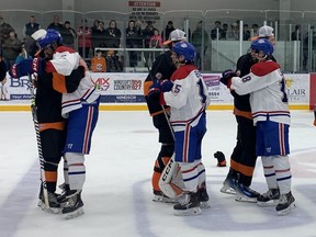 Essex 73 members (black) and Lakeshore Canadas (white) shake hands, Essex beat Essex 5-3, the first time since 2017 to win Bill Stobbs in the provincial junior hockey league.