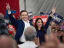 Conservative leader Pierre Poilievre and his wife Aiaida Poilievre waved to a crowd at a campaign rally in Windsor. On Friday, April 11, 2025.