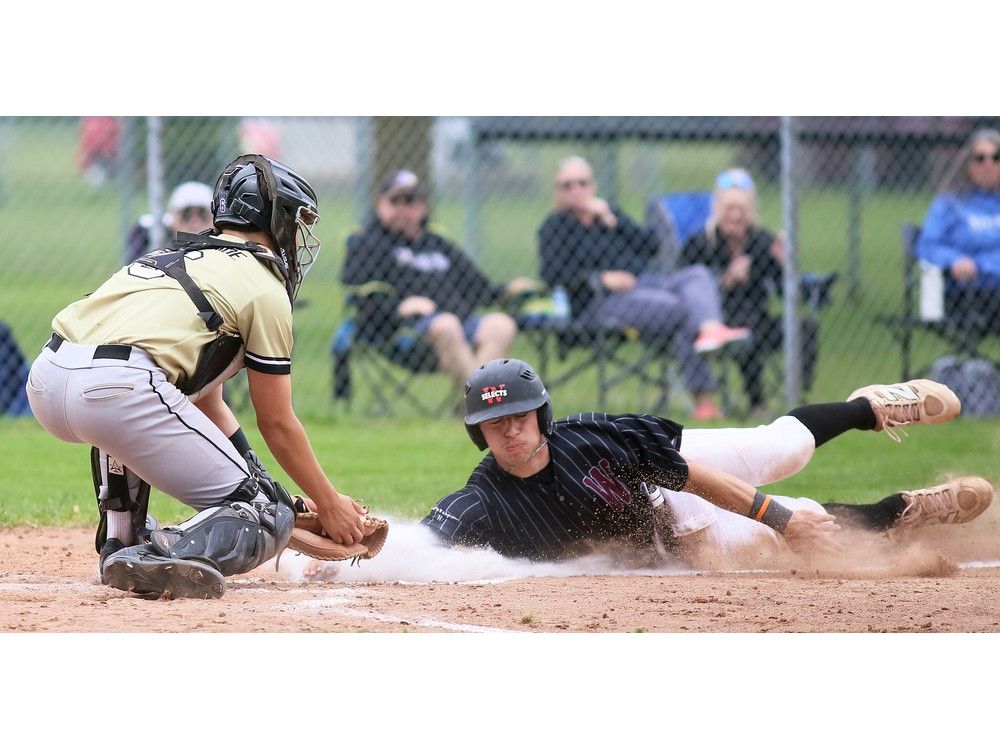  wallaceburg tartans’ lucas laprise is tagged out at home plate by riverside stingers’ catcher miles lepore in the swossaa baseball challenge game.