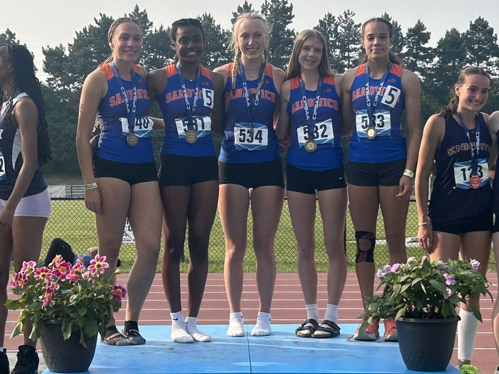  the sandwich sabres’ (from left) ella steel-dougas, jaela bailey, gwen flanagan, julia carswell and janelle davis stand atop the podium after receiving their gold medals for winning the open girls’ 4×400-metre relay on saturday at the ofsaa track and field championships at the toronto track and field centre at york university.