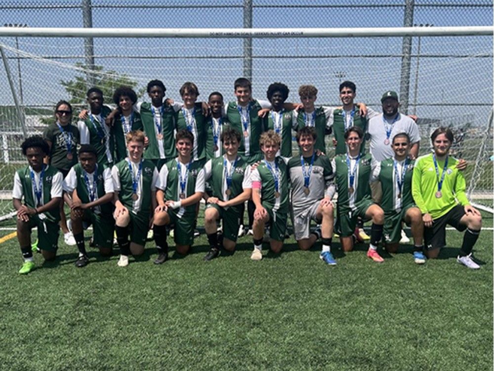 members of the lajeunesse royals gather after capturing the bronze medal at the ofsaa boys' a soccer championship on saturday.