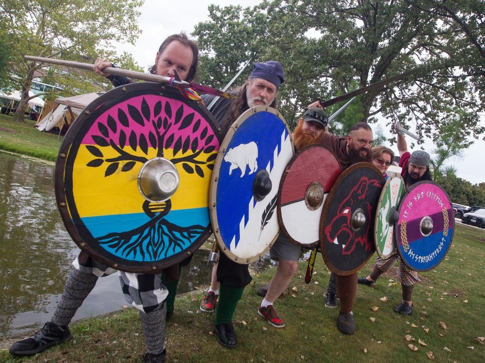 Members of Rósstad Norsefolk Viking group forming a shield wall