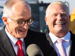 Vianode CEO Burkhard Straube jokes he won’t sing to Doug Ford despite it being the Ontario premier's birthday as they joined other officials to detail the Norwegian firm's $3.2-billion investment in a St. Thomas plant. Photo taken in St. Thomas on Thursday Nov. 20, 2025. (Mike Hensen/The London Free Press)