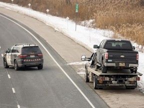 Police say a tow truck operator was struck and killed while helping a stranded motorist on Highway 401 west of the Oxford Road 3 overpass, east of Woodstock, on Dec. 3, 2025. (Mike Hensen/The London Free Press)