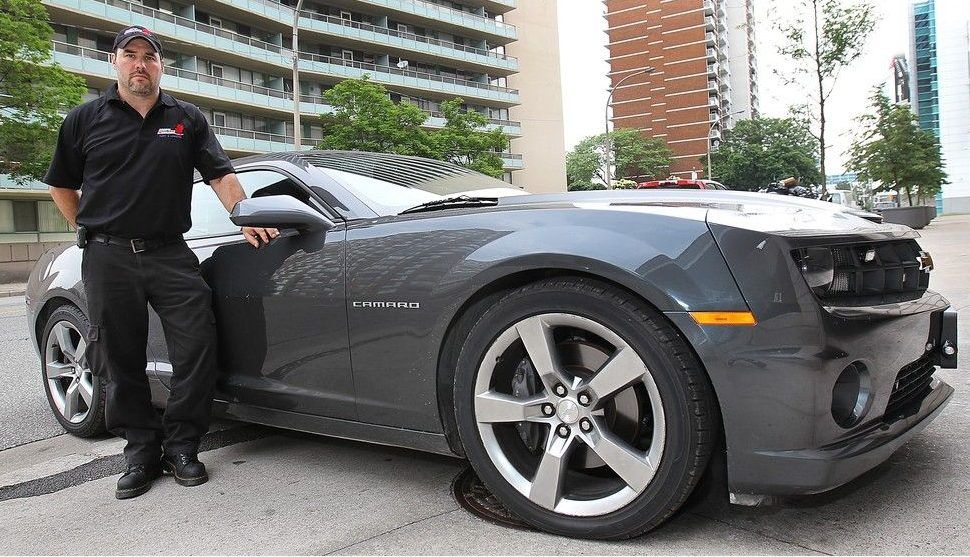  Windsor police fleet manager James Brush is shown with the department’s 2011 undercover Chevrolet Camaro in this June 12, 2015, Windsor Star file photo.
