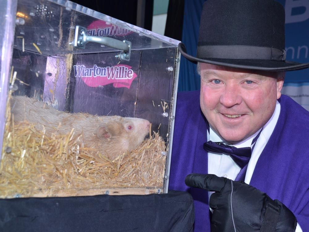 Wiarton mayor Jay Kirkland points to Wiarton Willie during a Groundhog Day event in Wiarton, Ont. on Sunday, Feb. 2, 2025.
