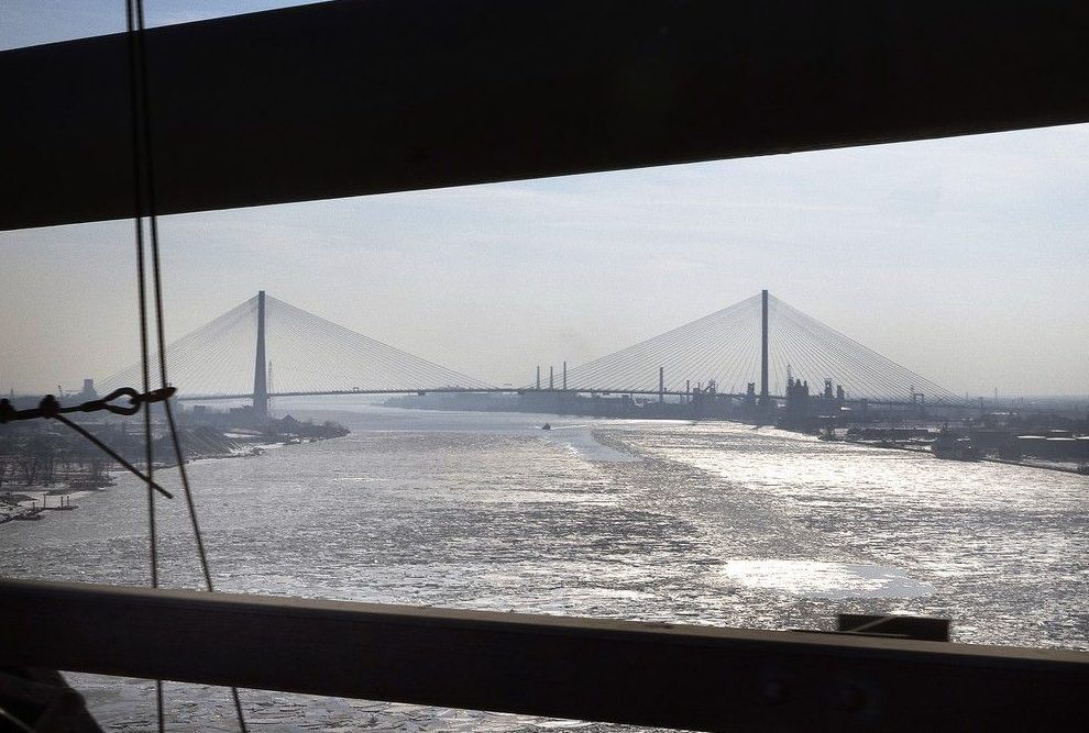  The Gordie Howe International Bridge is framed by a section of the upstream Ambassador Bridge on Feb. 10, 2026.