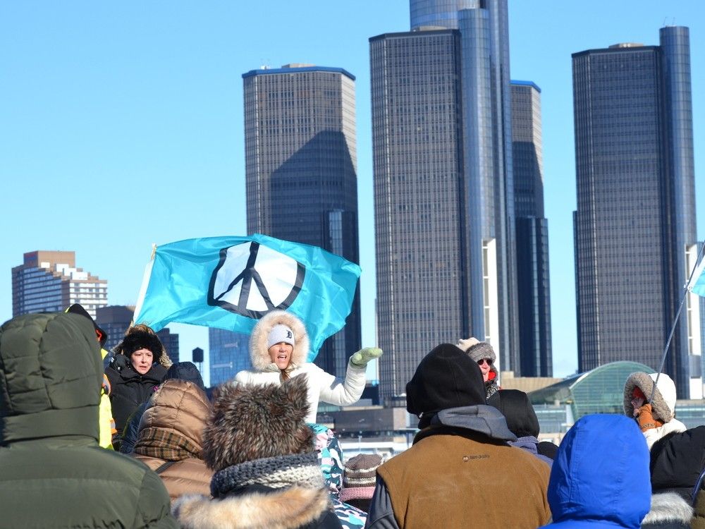 In quiet protest, a large group of walkers spread a message of peace through downtown Windsor Saturday.