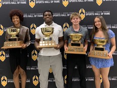 From left, Assumption's Saryna Milne, Holy Names' Ronnie Adogah, Essex's Braeden Cavanagh and Erie Shores' Natalie Mann each pose with their Hadre Cup Award, for boys, and Repko Cup Award, for girls, at the Ciociaro Club. The four were recognized as WECSSAA's top student-athletes for 2025-26.