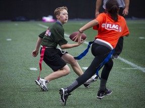 The CFL and NFL launched a flag football program of coed teams of 11-12-year olds to take part in nine regional tournaments to be held in CFL cities, coming together for a national tournament during Grey Cup week in the nation's capital. 12-year-old Kent Moors gets the ball down the field during a round robin game at TD Place Sunday October 15, 2017.   Ashley Fraser/Postmedia
Ashley Fraser, Postmedia