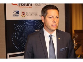 Mayor Brian Bowman speaks with reporters a few hours before his visit to New York City to meet with international bond-rating agencies on Monday, Oct. 2, 2017. JOYANNE PURSAGA/Winnipeg Sun