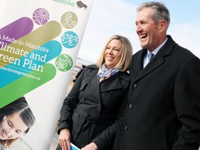 Sustainable Development Minister Rochelle Squires (sharing a smile with Premier Brian Pallister at the province's A Made-in Manitoba Climate and Green Plan announcement Friday) won`t say if the province will side with Manitobans if they tell the government they don’t want a five-cents-per-litre tax at the pump.