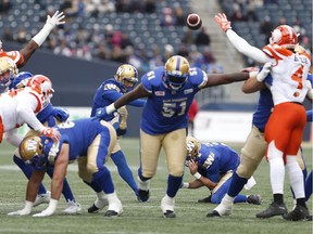 Winnipeg Blue Bombers' Justin Medlock (9) kicks a successful field goal against the B.C. Lions during the first half on Saturday.