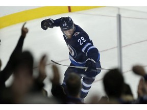 Winnipeg Jets' Patrik Laine (29) celebrates his goal against the Minnesota Wild during first period in Winnipeg on Friday, October 20, 2017. In the first seven games, Laine has four goals and five points.