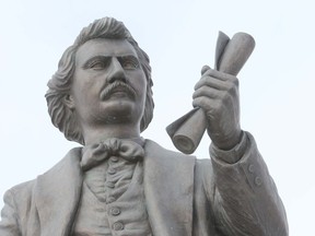 A statue depicting Louis Riel at the Manitoba Legislature.