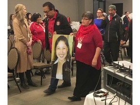 Bernice Catcheway, right, carries a picture of her daughter, Jennifer Catcheway, into a hearing of the national inquiry into missing and murdered women in Winnipeg on Friday Oct. 20, 2017. Jennifer Catcheway disappeared in 2008 and her family says they feel abandoned by police and other authorities as they continue to search for her. THE CANADIAN PRESS/Steve Lambert ORG XMIT: CPT111
Steve Lambert,