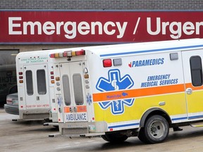 Ambulances sit outside St. Boniface Hospital in Winnipeg, Man. Monday January 26, 2015. A new city report states that the hospital has the longest wait times.