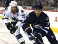 Winnipeg Jets defenceman Toby Enstrom (right) is expected to miss eight weeks with a lower-body injury.