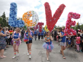 Participants march during the 30th annual Pride Winnipeg parade in Winnipeg on Sunday, June 4, 2017.