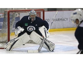 Steve Mason stares down a shooter during Winnipeg Jets practice at MTS Iceplex in Winnipeg on Monday Oct. 16, 2017