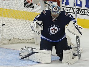 Winnipeg Jets goaltender Steve Mason fights off a shot from the Columbus Blue Jackets in Winnipeg on Tues., Oct. 17, 2017. Kevin King/Winnipeg Sun/Postmedia Network