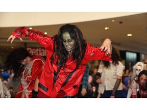 Zumba dance instructor Karla Mozdzen leads a flash zombie mob through a performance of the choreographed dance scene from Michael Jackson's Thriller at St. Vital Centre in Winnipeg on Sunday.