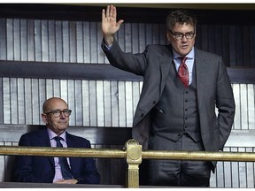 Manitoba Liberal Party leader Dougald Lamont (right), sitting with president Paul Brault, is acknowledged during question period at the Manitoba Legislature on Monday.