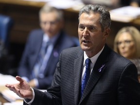 Premier Brian Pallister addresses the speaker during question period at the Manitoba Legislature in Winnipeg on Monday.