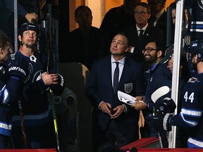 Former Winnipeg Jets great Dale Hawerchuk watches a video tribute prior to his induction into the Winnipeg Jets Hockey Hall of Fame before puck drop against the Arizona Coyotes on Tuesday.
 (Kevin King/Winnipeg Sun)