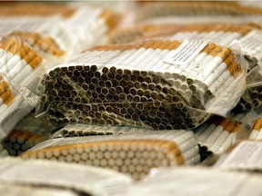 Two Manitobans are facing charges of trafficking and possession after Ontario Provincial Police seized 21 cases of illegal tobacco products on Sunday.