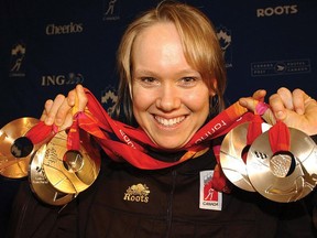 Cindy Klassen holds up the hardware at the Calgary International airport where she and members of the speed skating team returned from the olympics.n/a ORG XMIT: POS1608121143491722

31 S9 C Klassen Nancy                    cc-cataloged