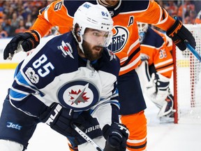 Winnipeg Jets v Edmonton Oilers

EDMONTON, AB - OCTOBER 09: Adam Larsson #6 of the Edmonton Oilers battles against Mathieu Perreault #85 of the Winnipeg Jets at Rogers Place on October 9, 2017 in Edmonton, Canada. (Photo by Codie McLachlan/Getty Images)
Codie McLachlan, Getty Images