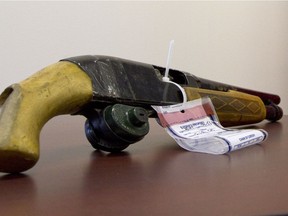 Calgary Sun - 02/22/10 - A sawed-off shotgun sits on display during a press conference releasing the results of an internal police inquiry of the fatal shooting during a police standoff on May 24, 2009. BRANDON MCKAY/SPECIAL TO QMI AGENCY
Brandon McKay, BRANDON MCKAY/SPECIAL TO QMI AGENCY