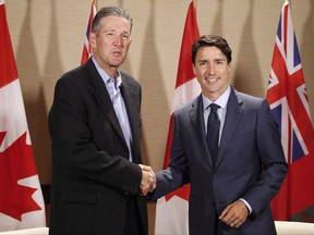 Manitoba Premier Brian Pallister is dropping strong hints that the private sector will be involved in the distribution of marijuana when recreational use is legalized next year. Prime Minister Justin Trudeau meets with Manitoba Premier Brian Pallister in Winnipeg on Saturday, July 29, 2017. THE CANADIAN PRESS/John Woods