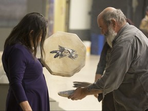 A smudging ritual using white sage is used  prior to a meeting for the Wobtegwa aboriginal community, a new Metis group that is trying to attract new members in Sherbrooke, Quebec November 19, 2017.  (Christinne Muschi /National Post)
