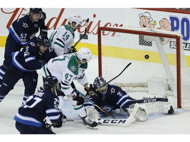 Dallas Stars' Alexander Radulov (47) scores on Winnipeg Jets goaltender Connor Hellebuyck (37) during first period NHL action in Winnipeg on Thursday, November 2, 2017. THE CANADIAN PRESS/John Woods ORG XMIT: JGW111
JOHN WOODS,