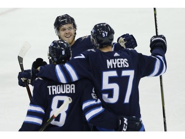 Winnipeg Jets' Jacob Trouba (8), Nikolaj Ehlers (27) and Tyler Myers (57) celebrate Myers' goal against the Dallas Stars during first period NHL action in Winnipeg on Thursday, November 2, 2017. THE CANADIAN PRESS/John Woods ORG XMIT: JGW109
JOHN WOODS,