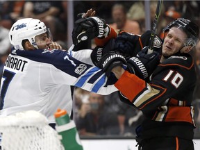 Winnipeg Jets defenceman Ben Chiarot (7) tangles with Anaheim Ducks right wing Corey Perry (10) during the second period Friday in Anaheim.