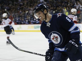 Winnipeg Jets' Jacob Trouba (8) celebrates his goal against the New Jersey Devils during the second period NHL action in Winnipeg on Saturday, November 18, 2017. THE CANADIAN PRESS/John Woods
