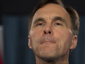 Minister of Finance Bill Morneau speaks with the media before Question Period on Parliament Hill, in Ottawa on Thursday, October 19, 2017. (THE CANADIAN PRESS/Adrian Wyld)