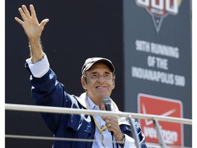 In this May 25, 2014 file photo, Jim Nabors waves to fans after singing before the start of the 98th running of the Indianapolis 500 IndyCar auto race at the Indianapolis Motor Speedway in Indianapolis. Nabors died peacefully at his home in Honolulu on Thursday with his husband Stan Cadwallader at his side. He was 87. (AP Photo/Michael Conroy, File)