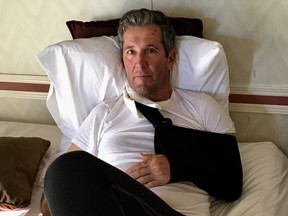Manitoba Premier Brian Pallister rests after breaking his arm during a fall while hiking in New Mexico.
Handout