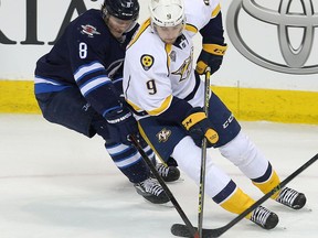 Nashville left winger Filip Forsberg (right) has been a prolific point-producer for the Predators and leads his team in scoring once again, and Jacob Trouba’s (left) job on the Jets' shutdown pairing will be to try to contain him.