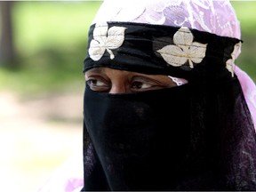 Woman wearing burka.