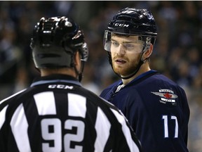 Winnipeg Jets centre Adam Lowry talks with linesman March Shewchyk during a break in NHL action against the Pittsburgh Penguins in Winnipeg on Wed., March 8, 2017. Kevin King/Winnipeg Sun/Postmedia Network ORG XMIT: POS1703082051412448
Kevin King, Kevin King/Winnipeg Sun